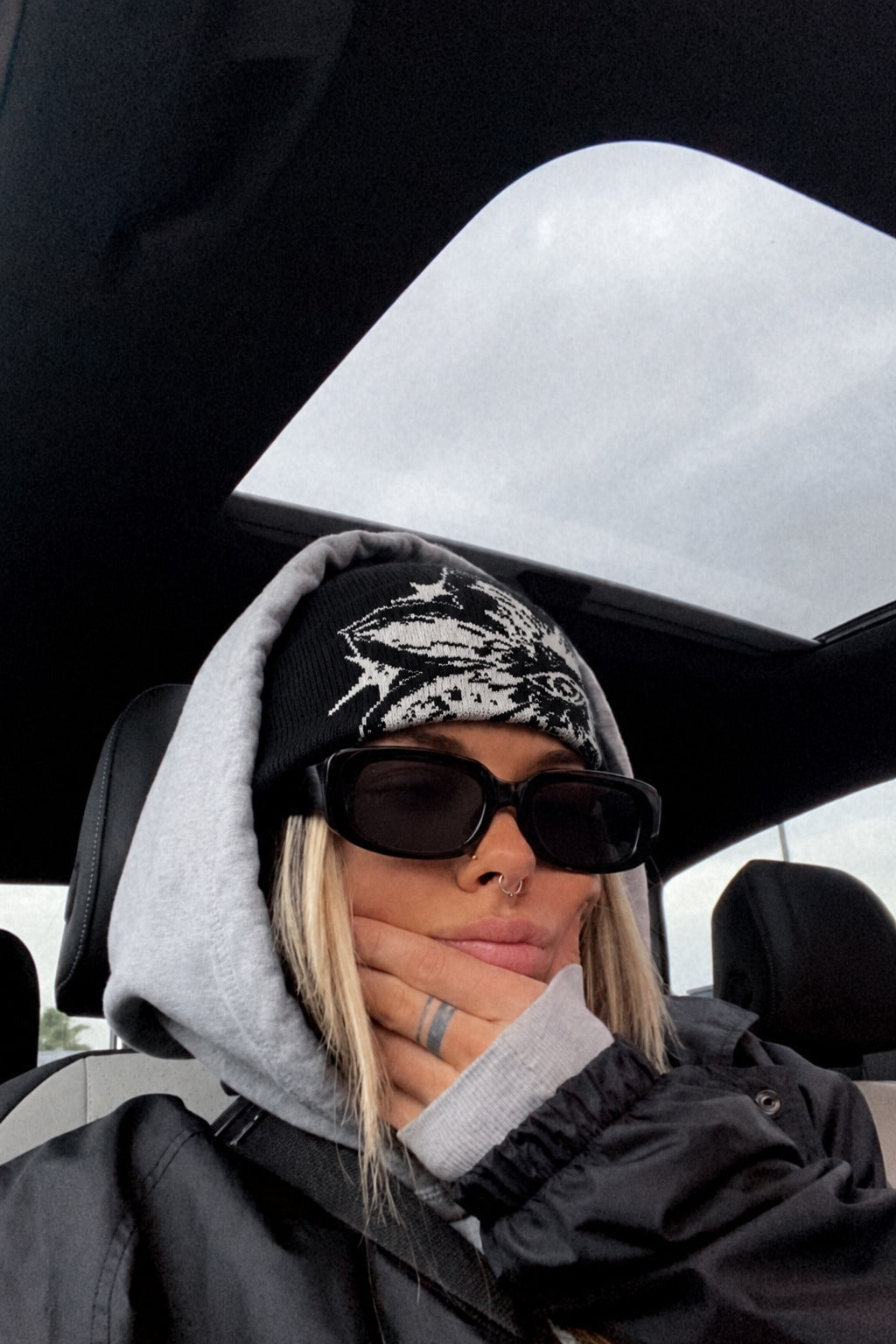 Model wearing The Rue Afterdark Bloom Beanie in Black And White.