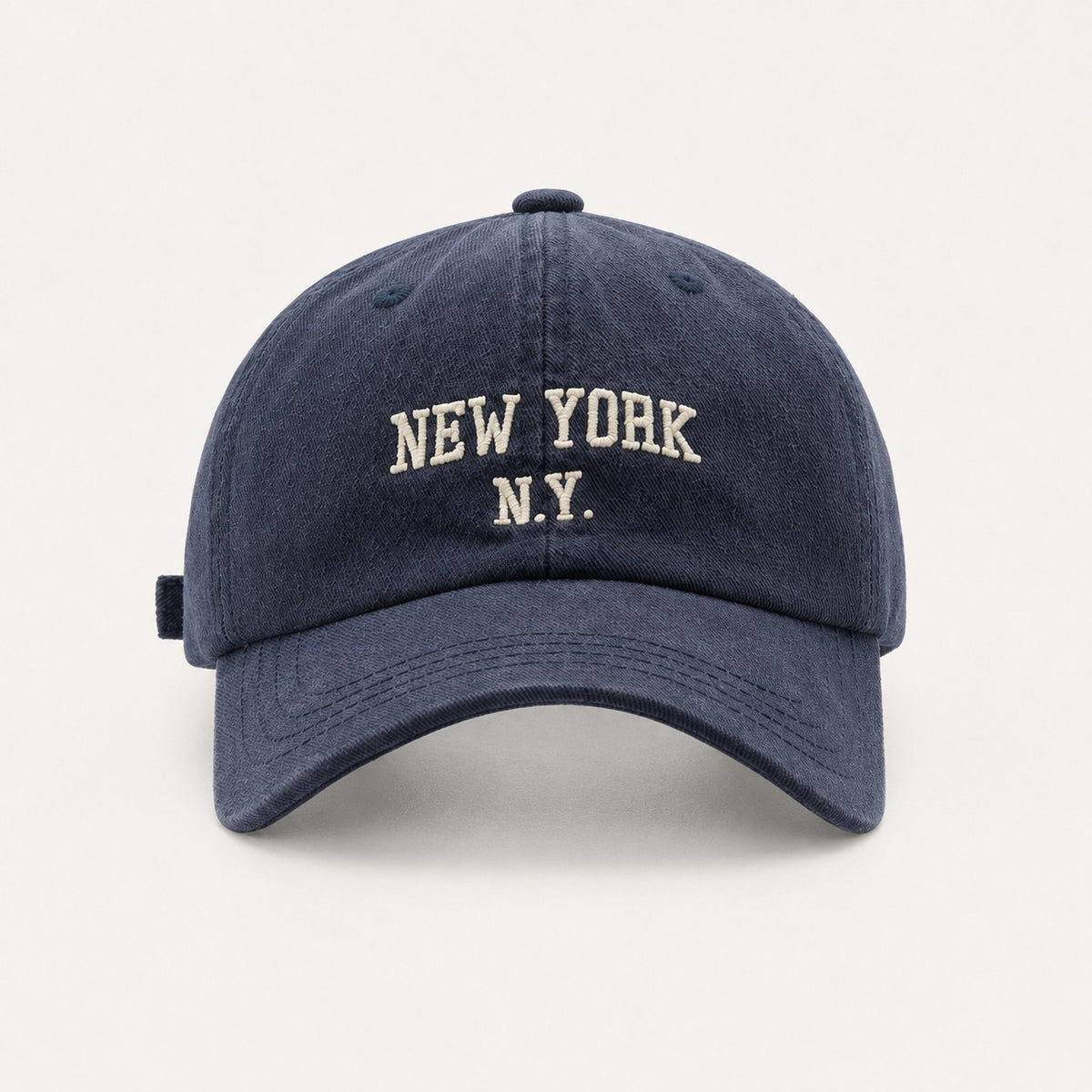 The Rue New York Cap in Navy, straight-on front view.