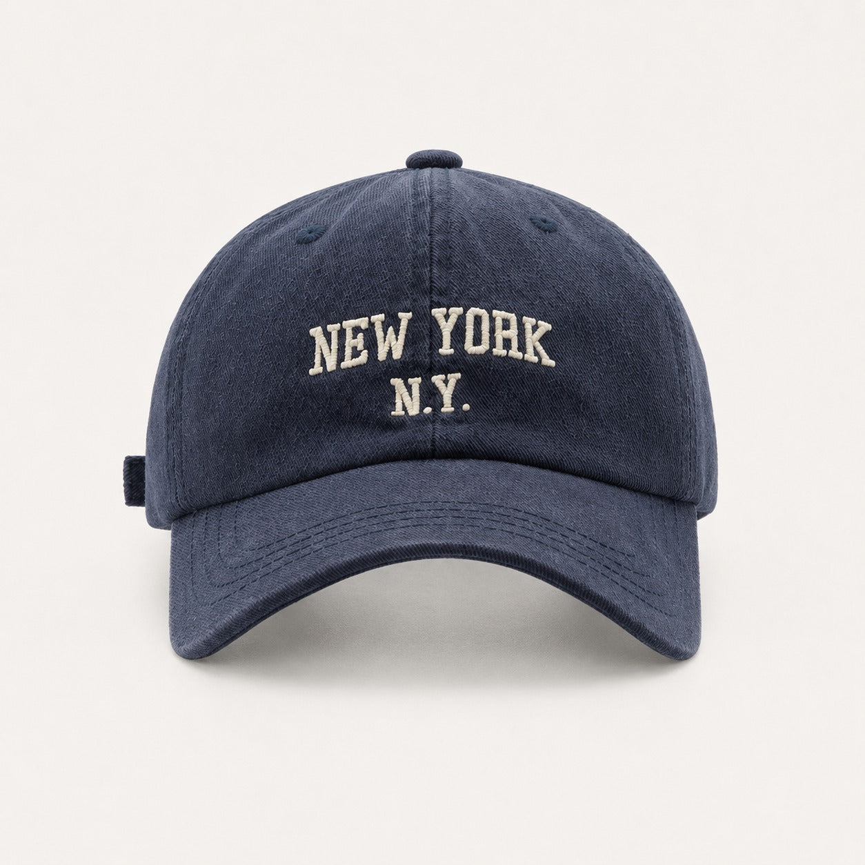 The Rue New York Cap in Navy, straight-on front view.