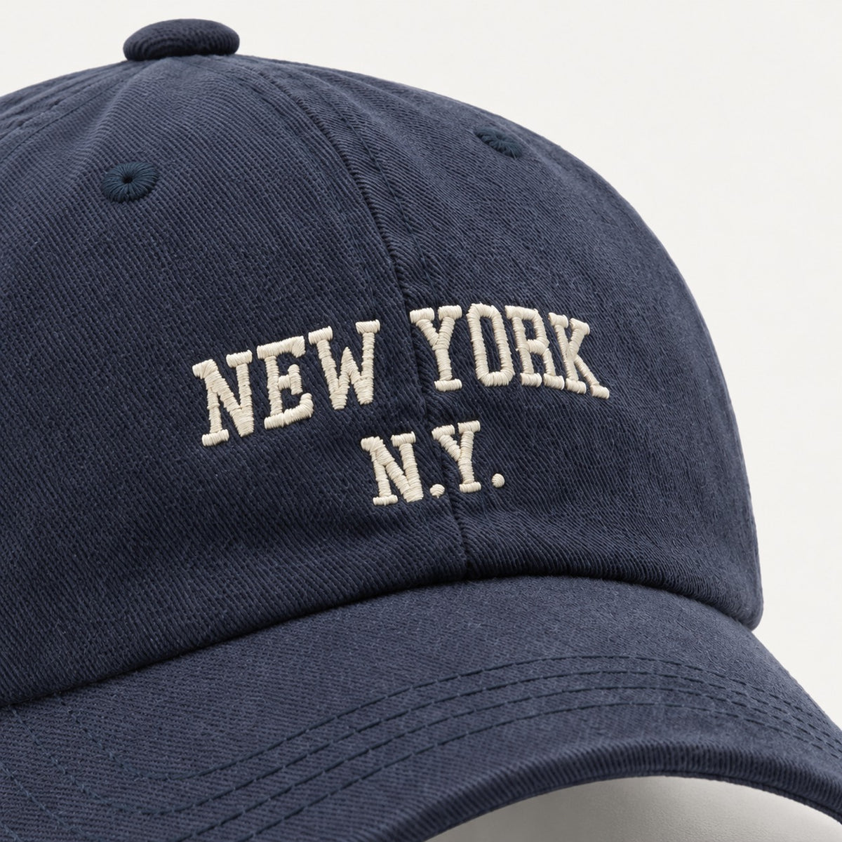 The Rue New York Cap in Navy, fabric and hardware detail.