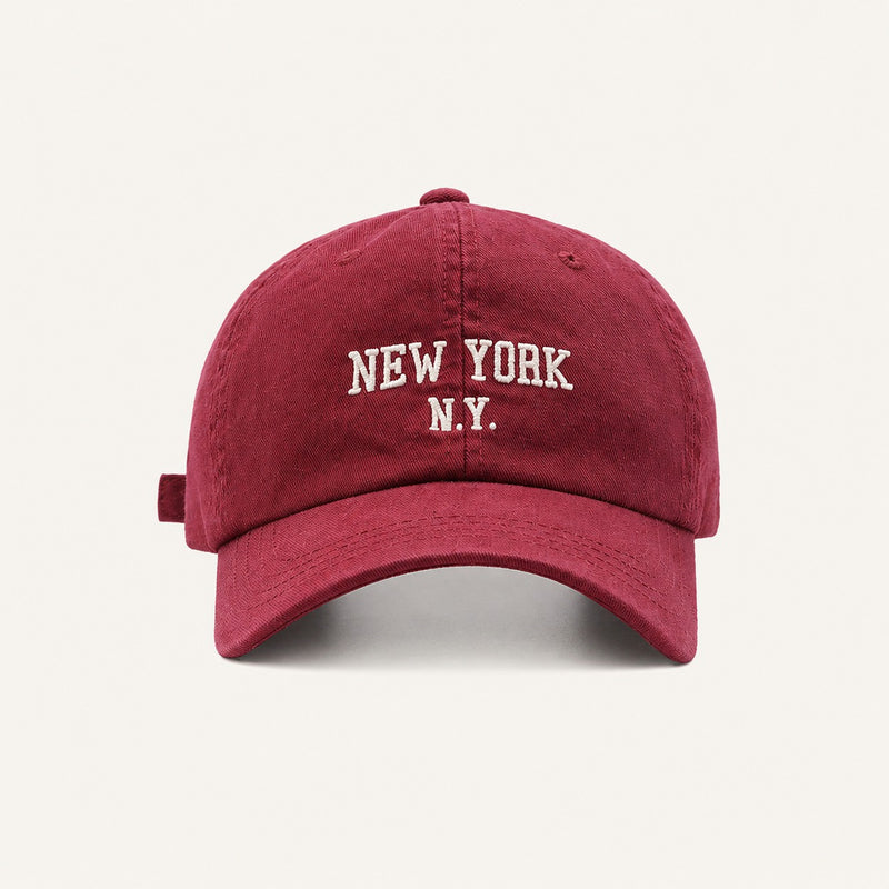 The Rue New York Cap in Cardinal Red, straight-on front view.