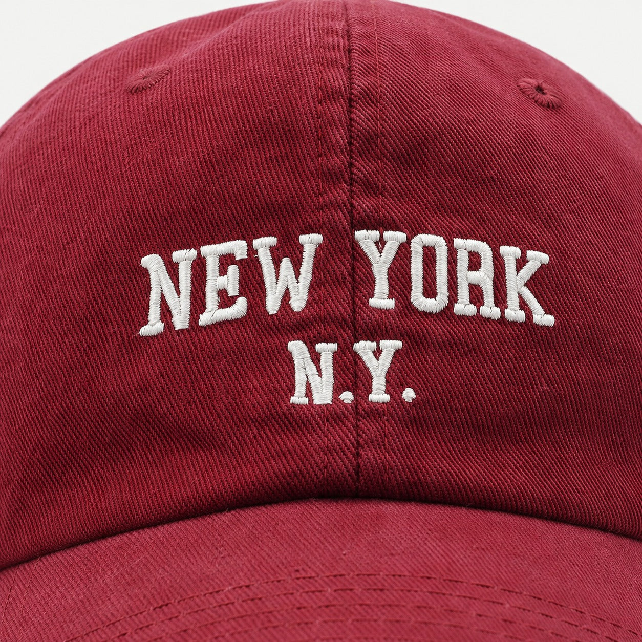The Rue New York Cap in Cardinal Red, fabric and hardware detail.