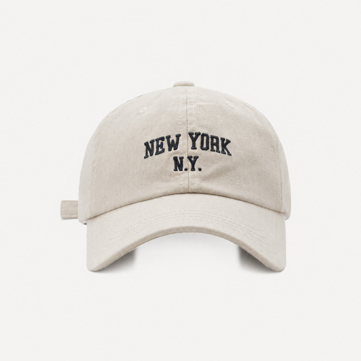 The Rue New York Cap in Bone, straight-on front view.