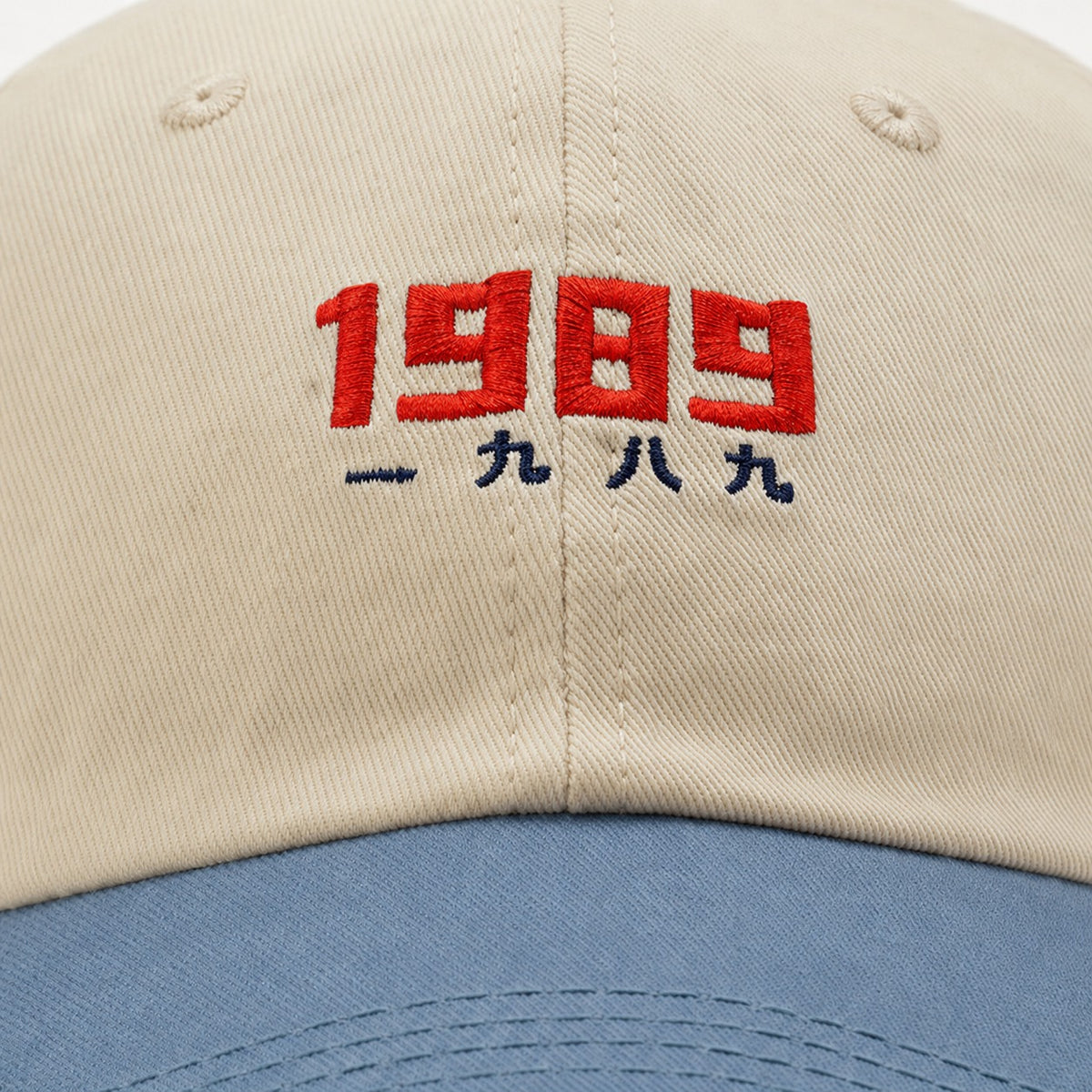 The Rue '89 Contrast Cap in Cream / Sky, fabric and hardware detail.