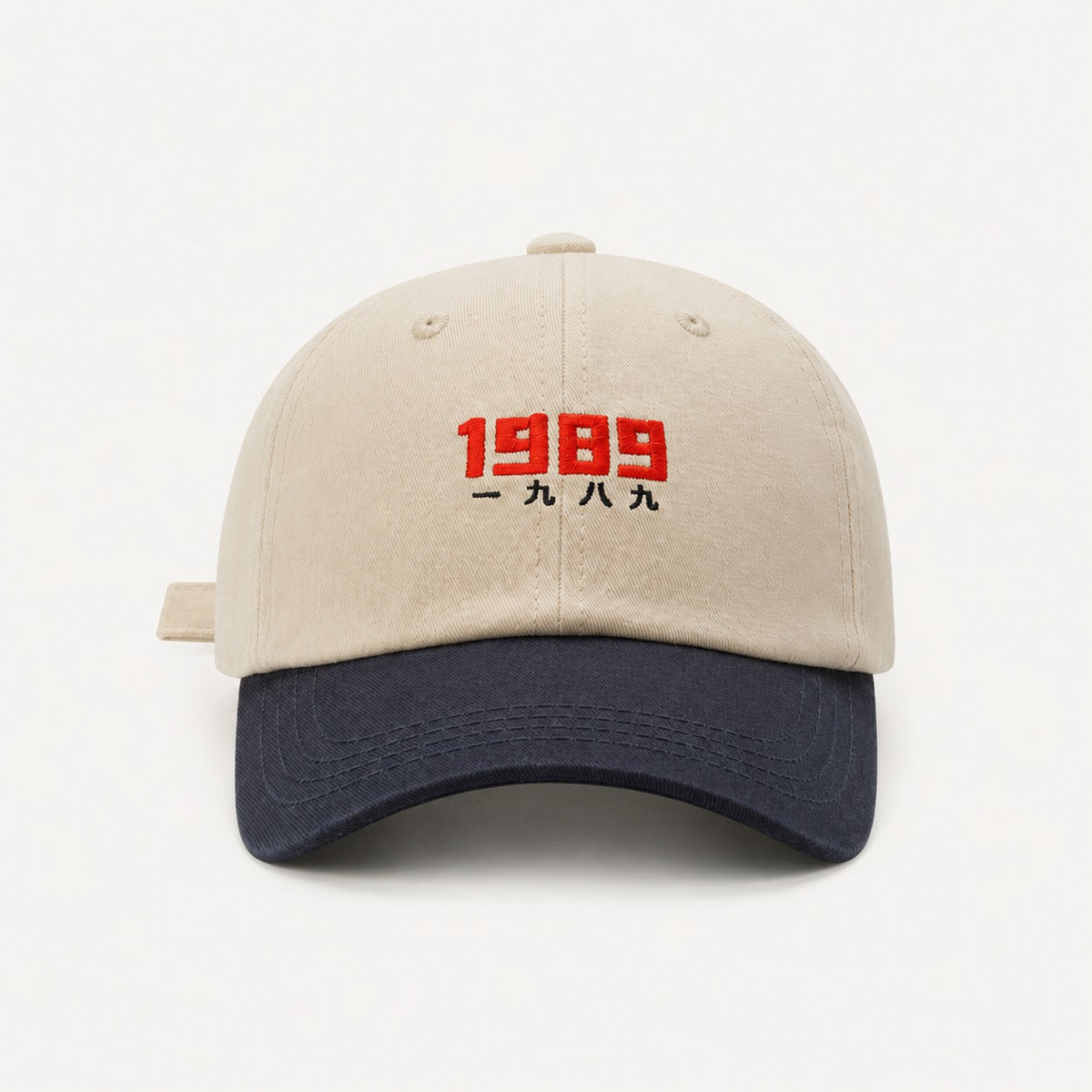 The Rue '89 Contrast Cap in Cream / Navy, straight-on front view.