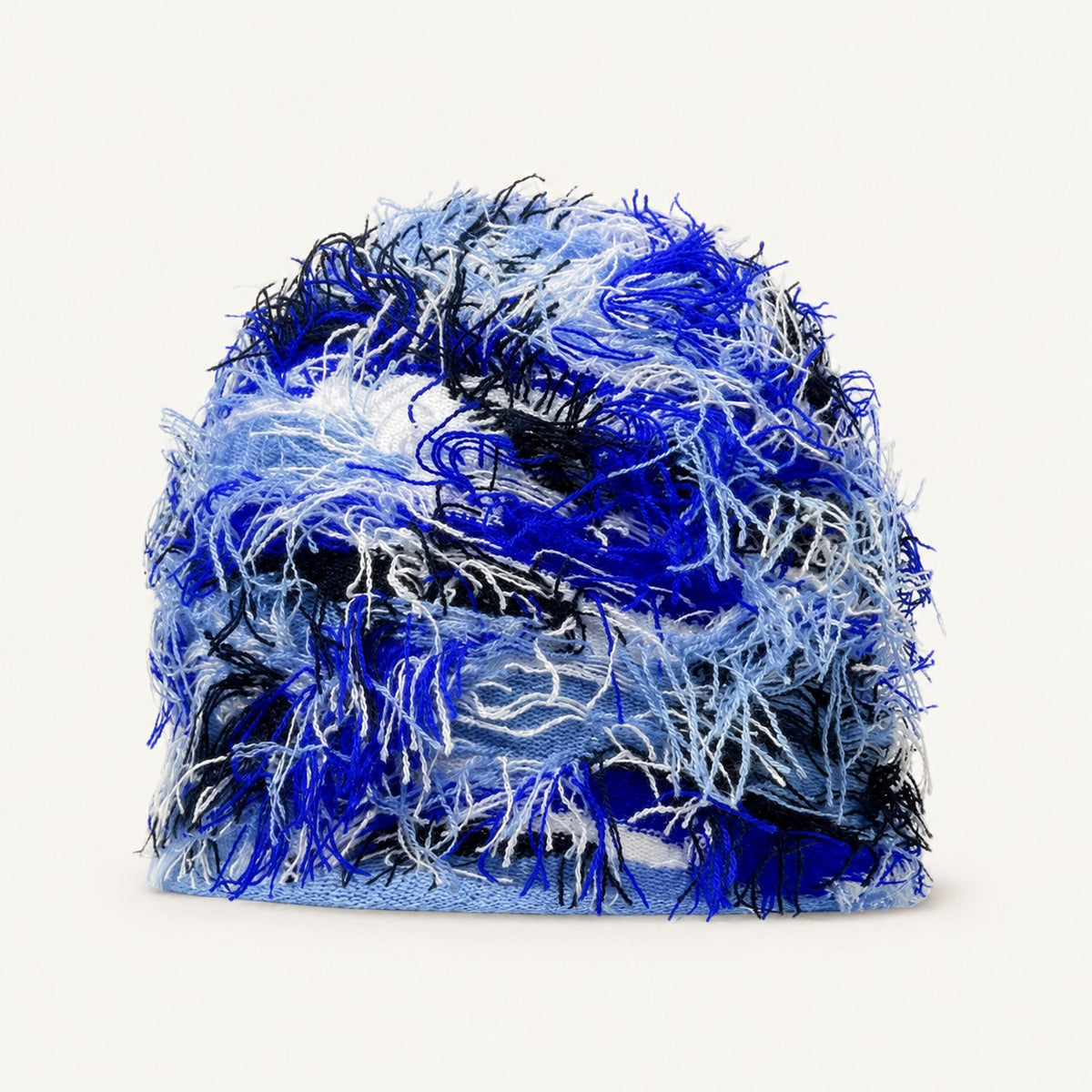 The Tangled Knit Beanie in Blue, front three-quarter view.
