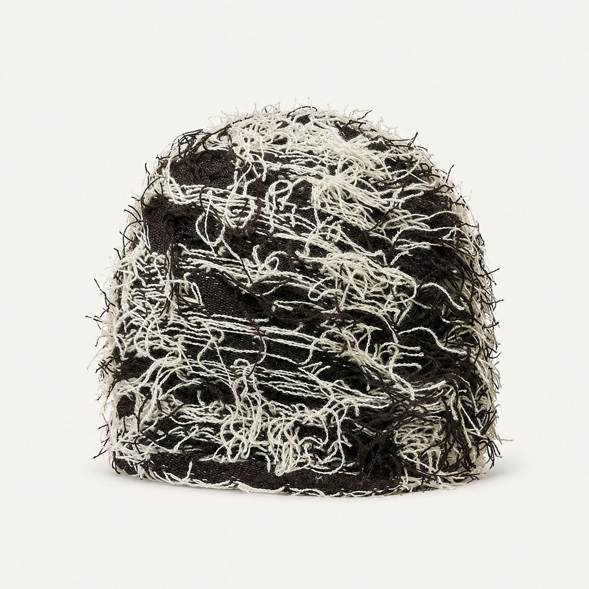 The Tangled Knit Beanie in Coffee Beige, front three-quarter view.
