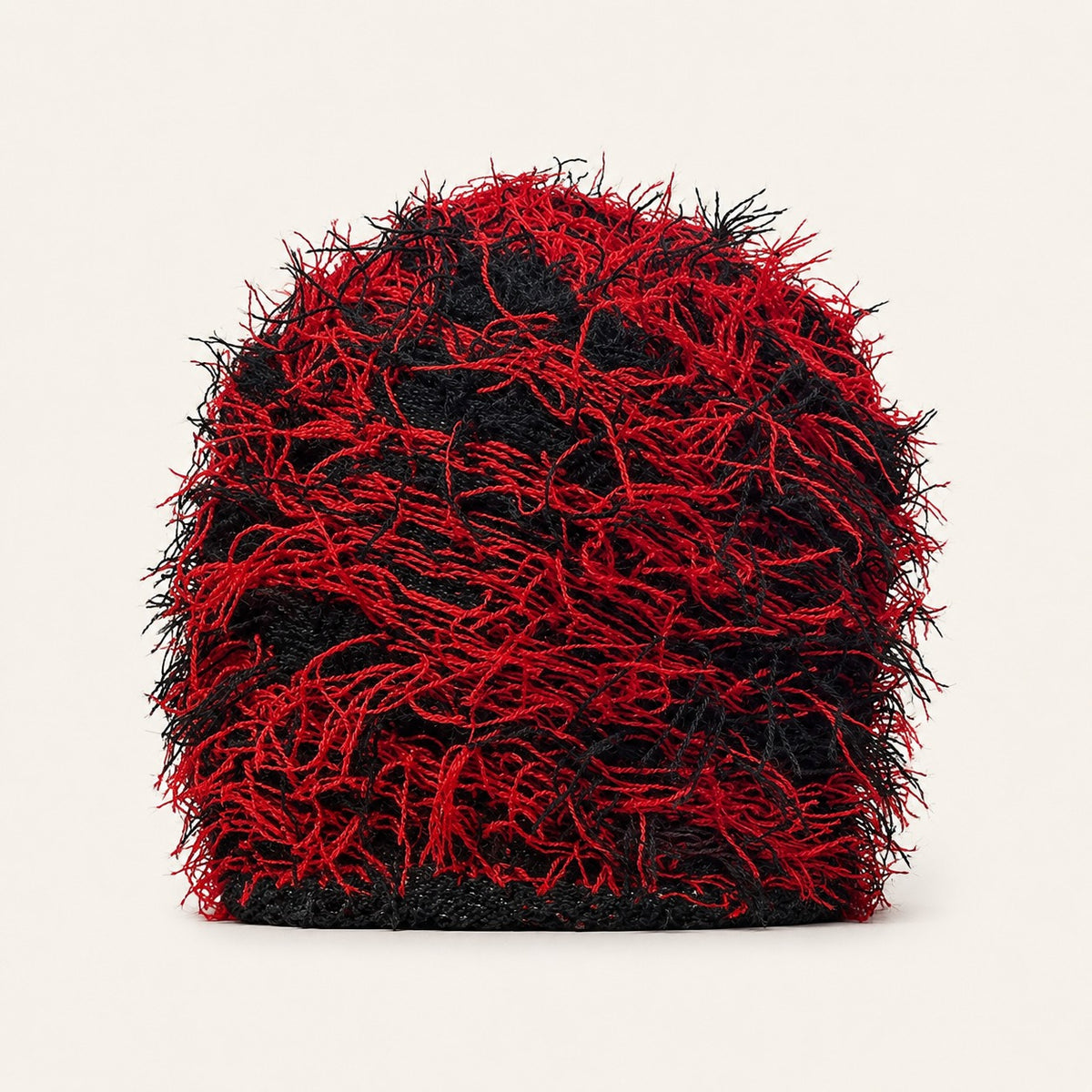 The Tangled Knit Beanie in Black And Red, front three-quarter view.